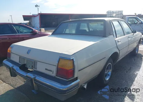 1984 Oldsmobile Delta 88 Royale Brougham z USA, uszkodzony, nr VIN 1G3AY69Y5EX343426